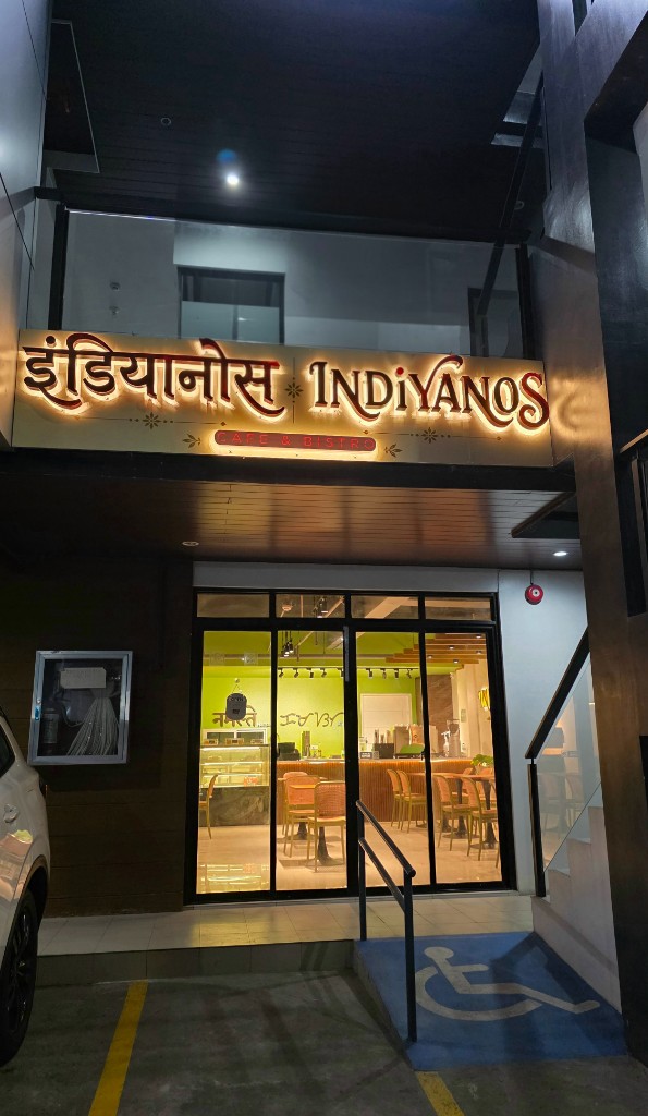 Indiyanos Cafe & Bistro storefront at night